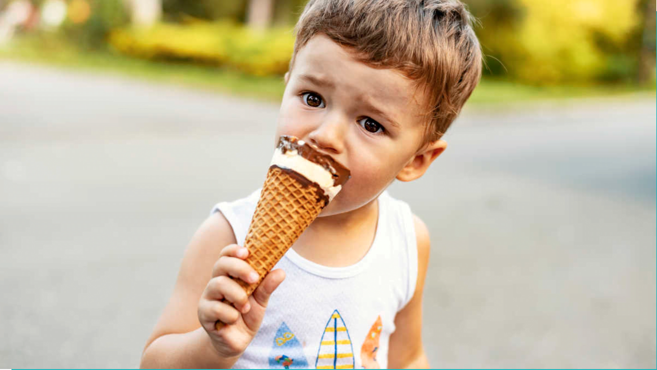 Boy eating ice cream with sugar