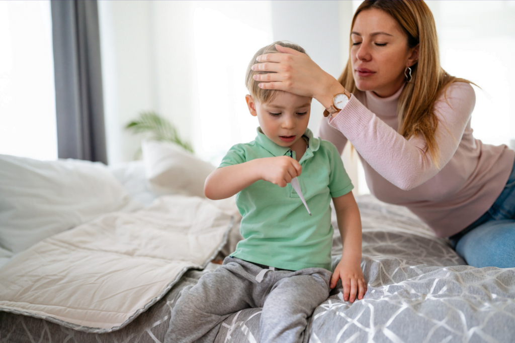 child unwell with suspected meningitis babysitter checking temperature
