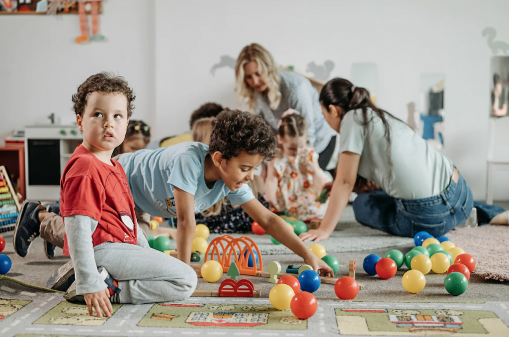 child learning through play with childminder