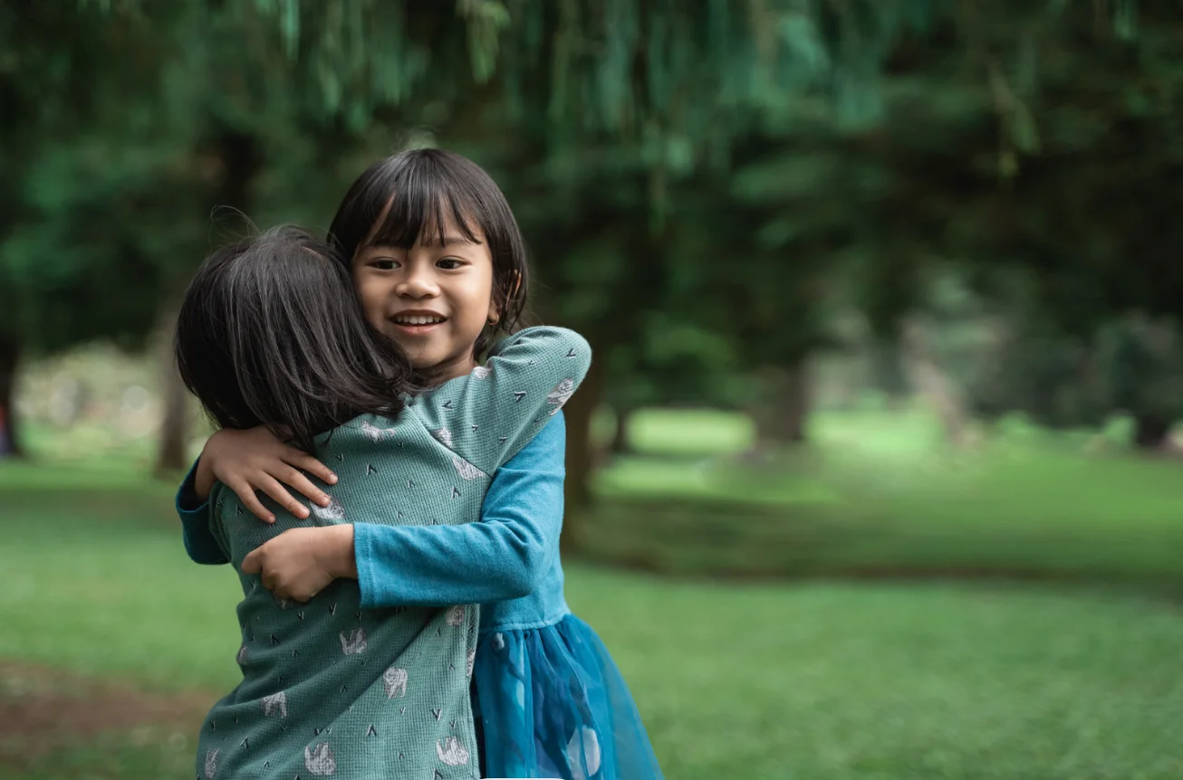 Happy children learning through playing, hugging