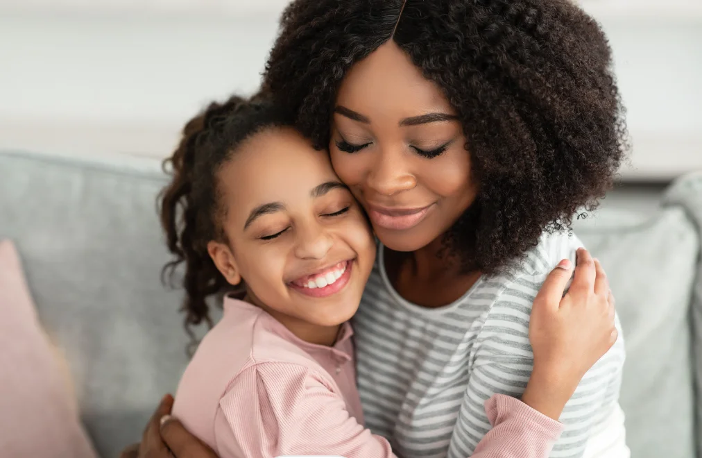 Child hugging a babysitter