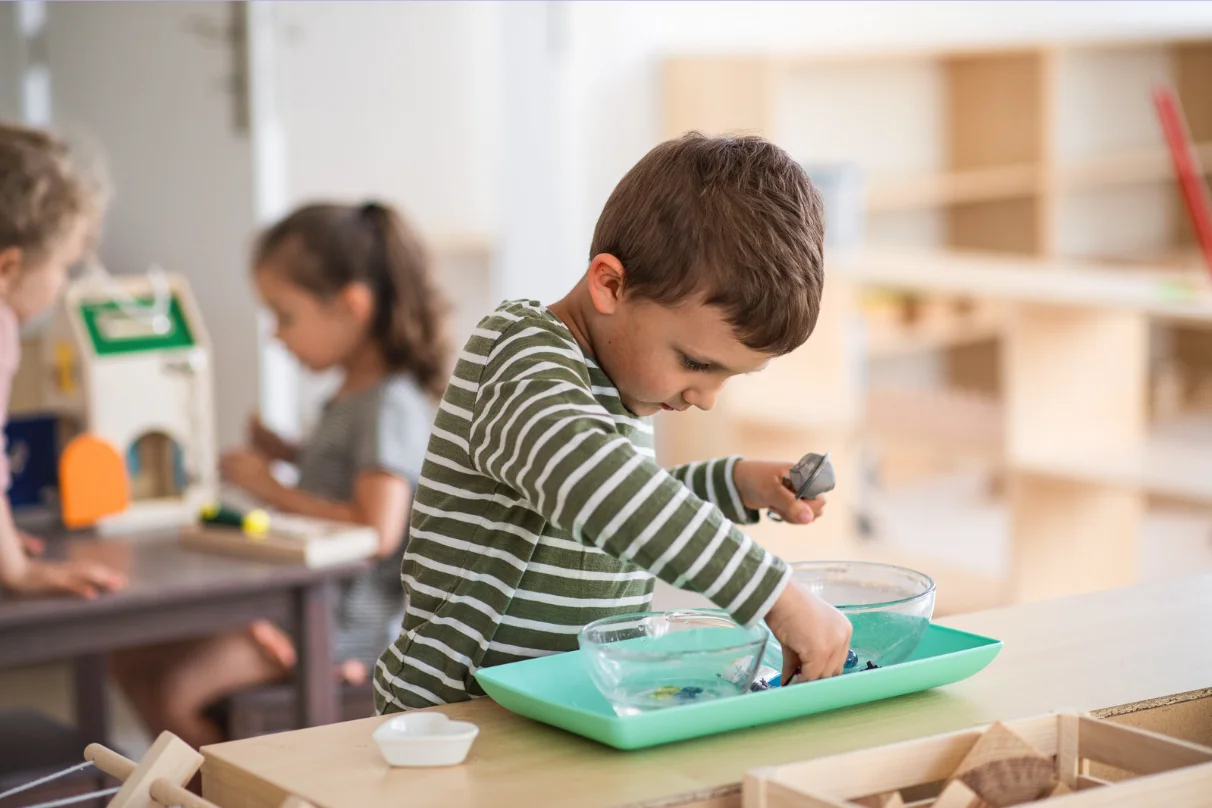 Young children learning basic math concepts in kindergarten