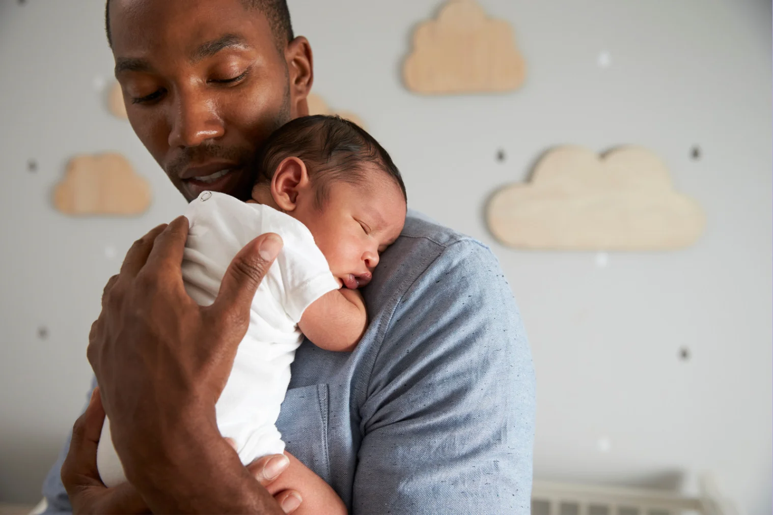 Father and newborn grunting and squirming while sleeping