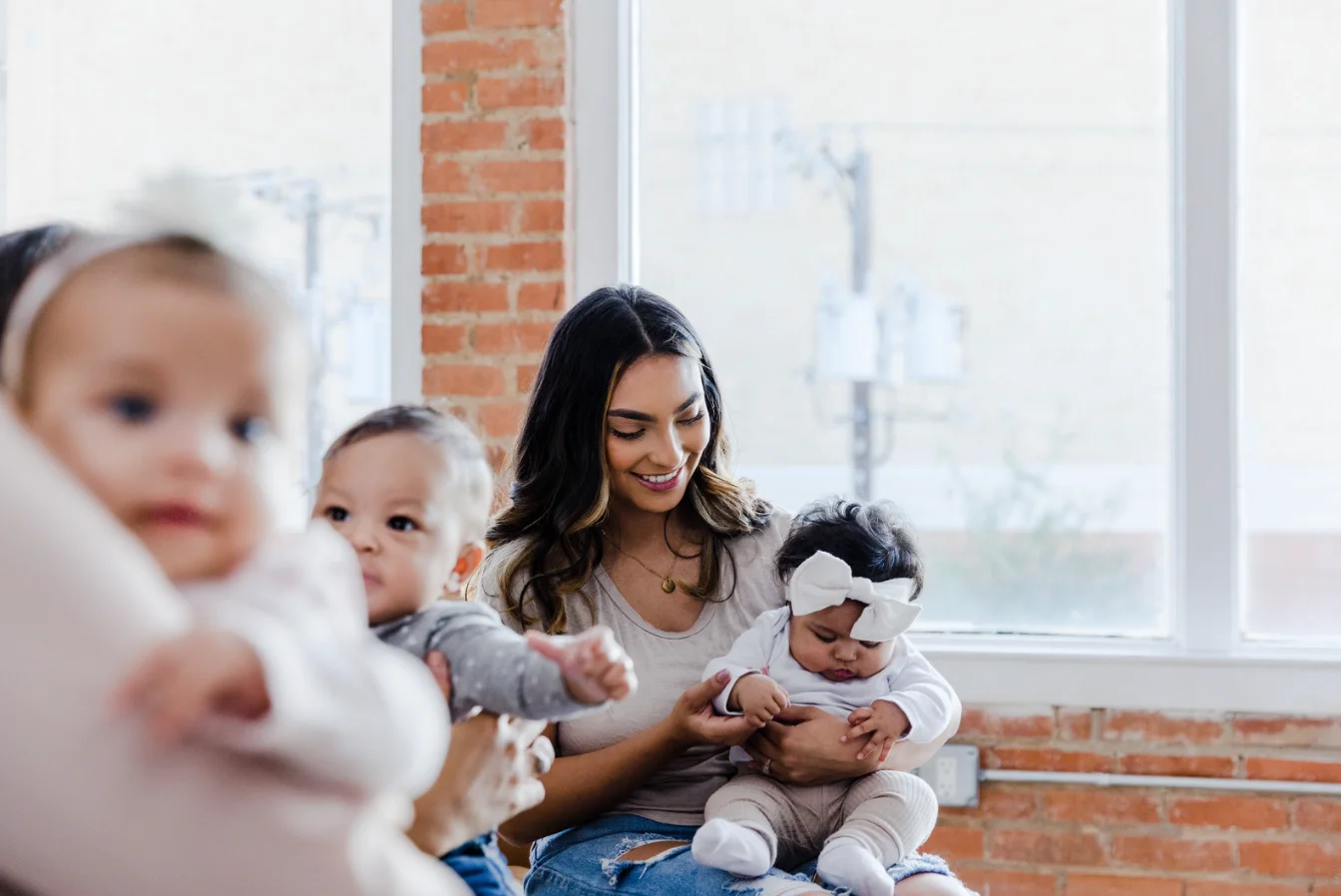 good mother with group of children at early age in support group