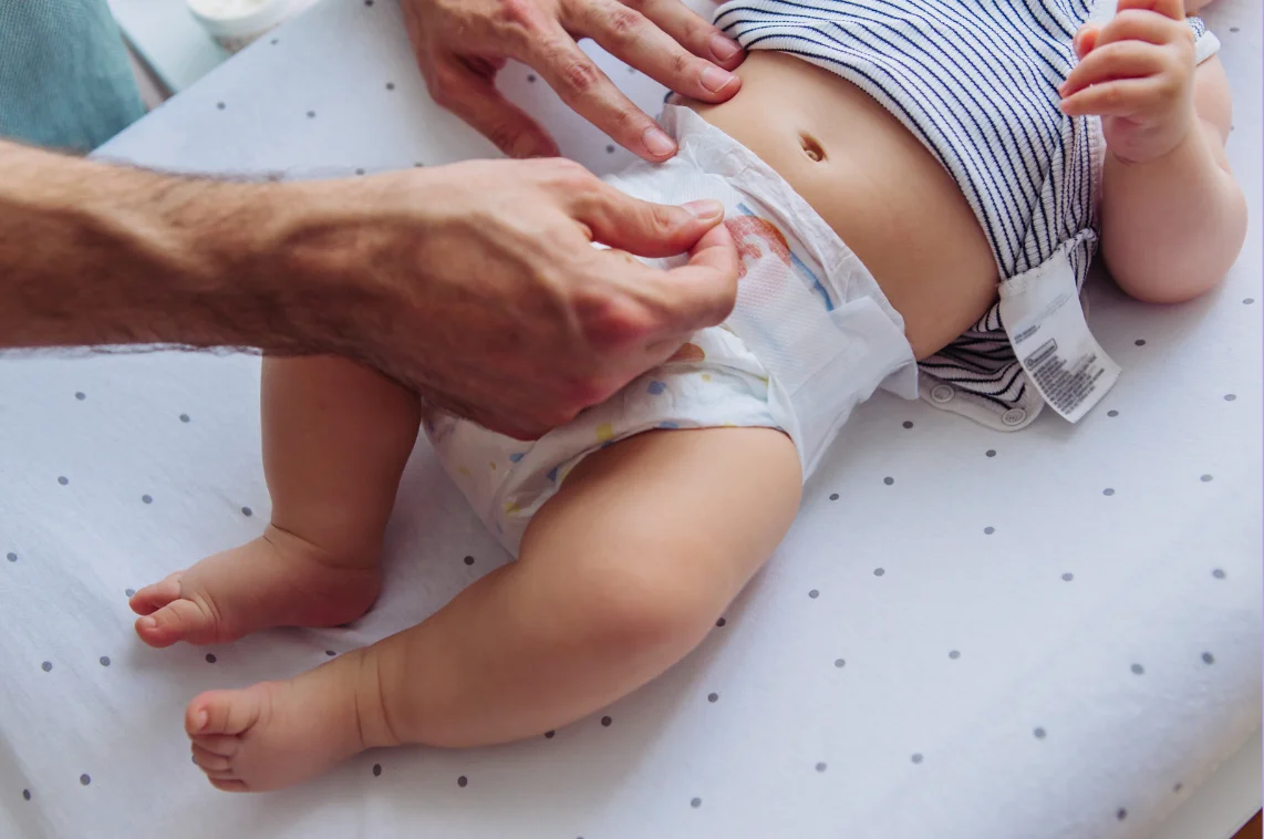 Older babies being changed after baby's stool