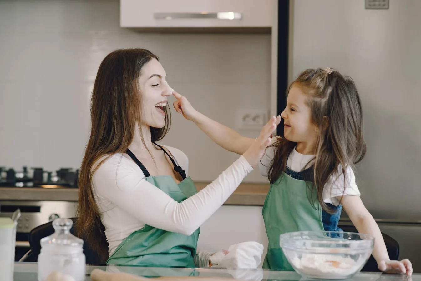 mother and child cooking, spending time building healthy relationship