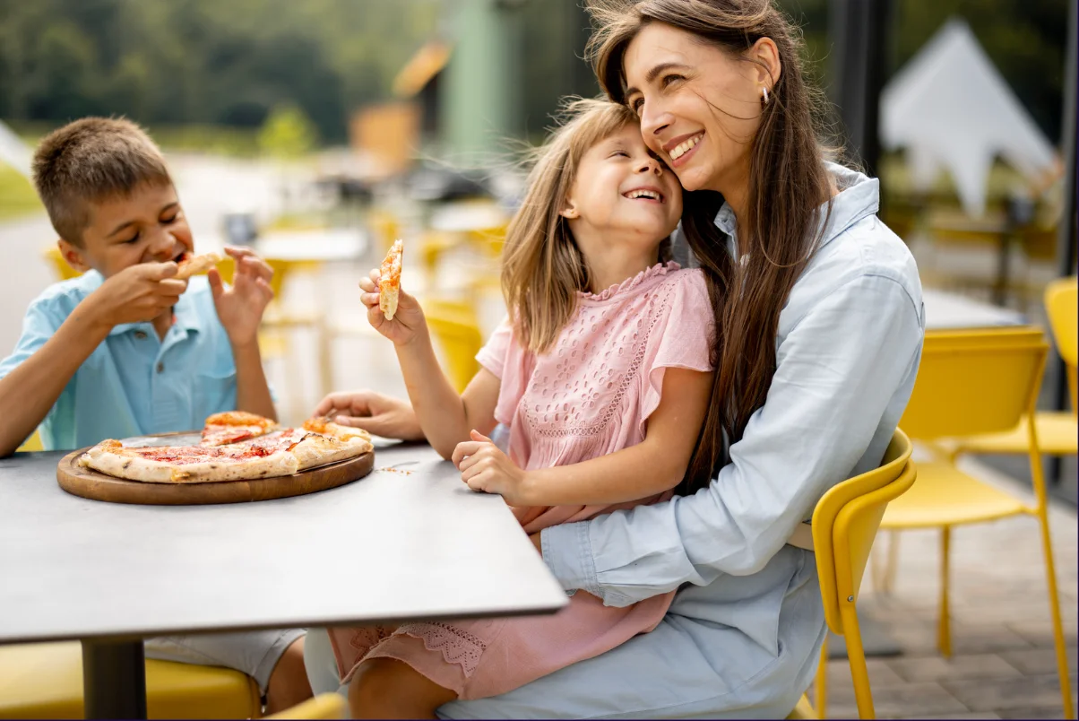good mother enjoying food with children