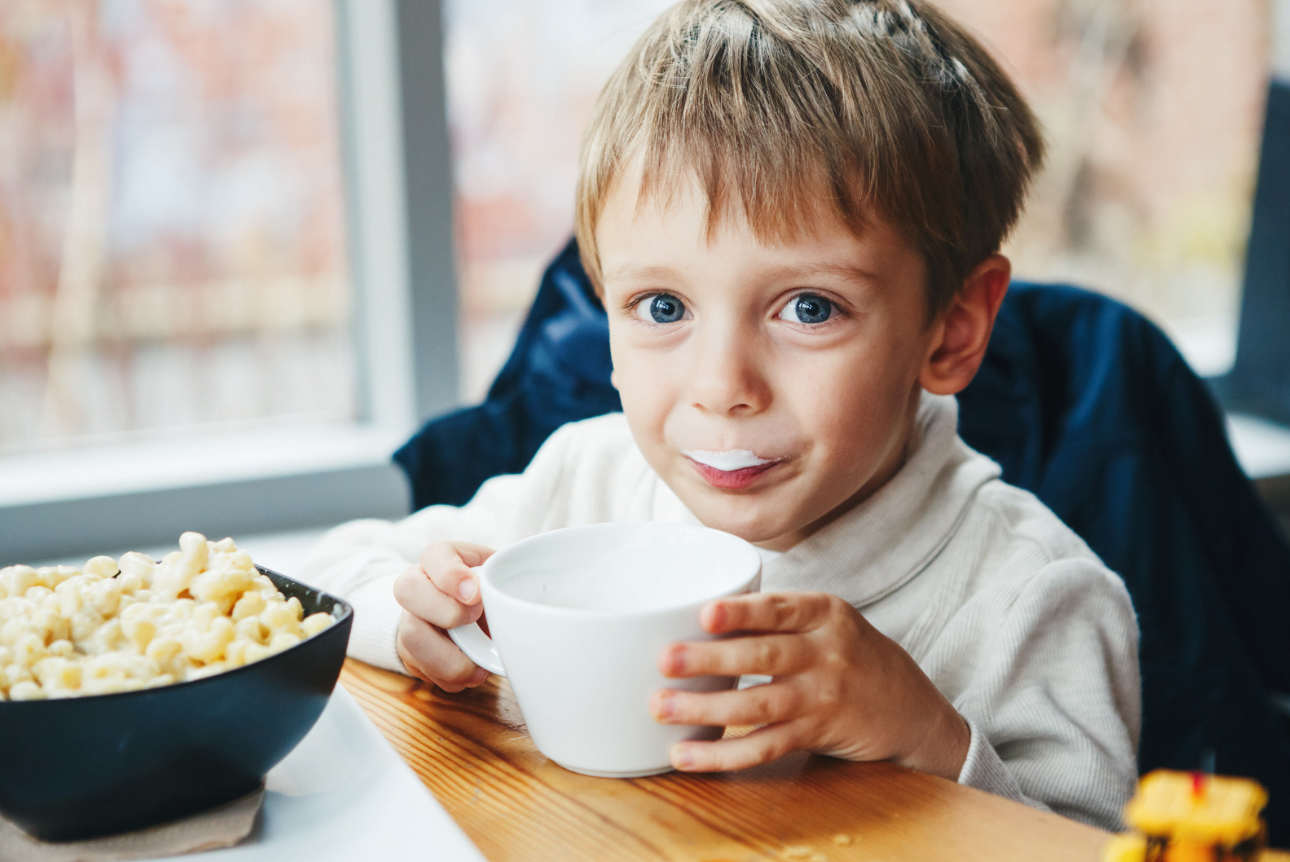 Child enjoying drink of milk