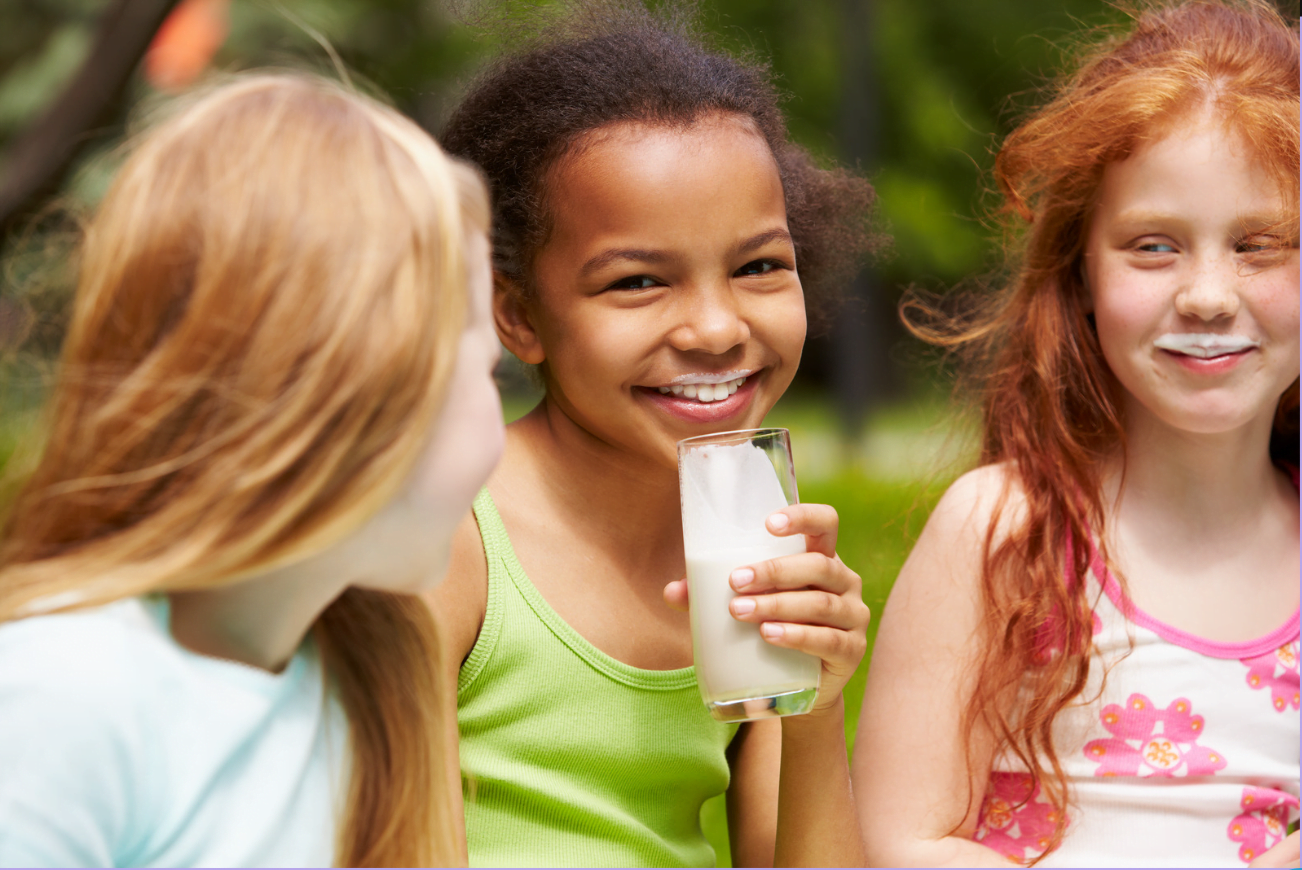 Healthy children drinking low fat milk with no added sugars