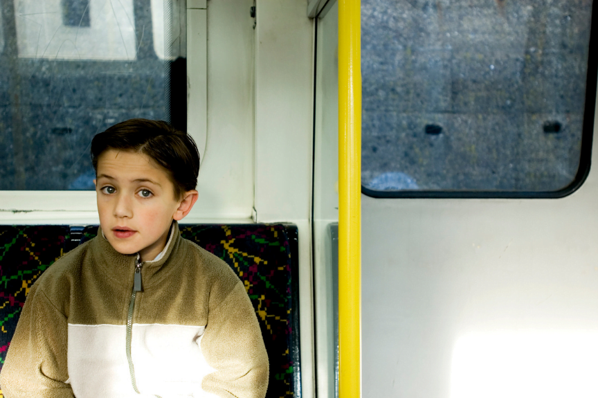 Young boy travelling on London Underground 