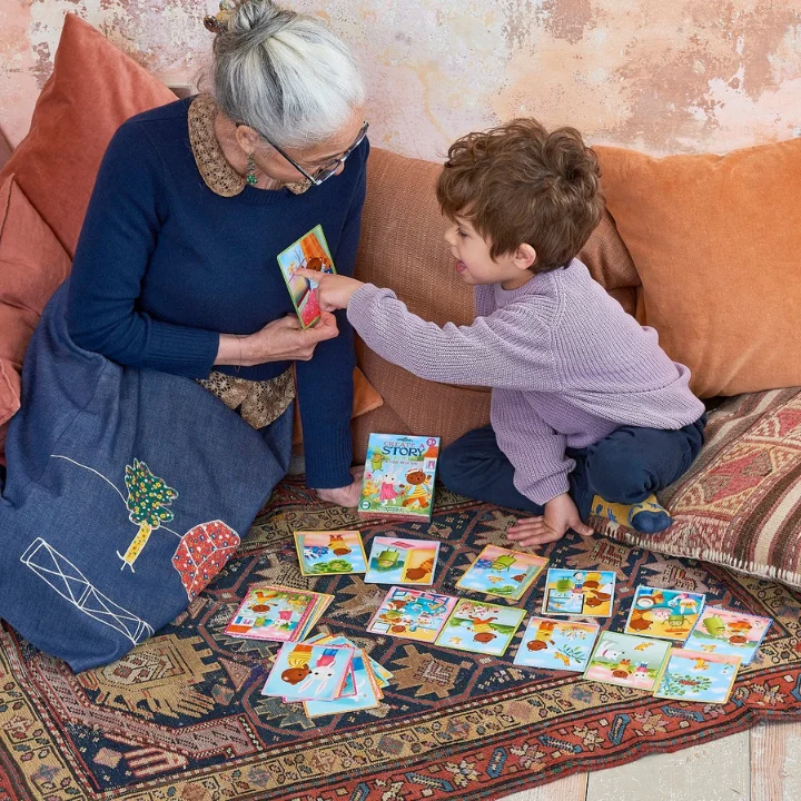 board game with cards grandmother and 3 year old playing