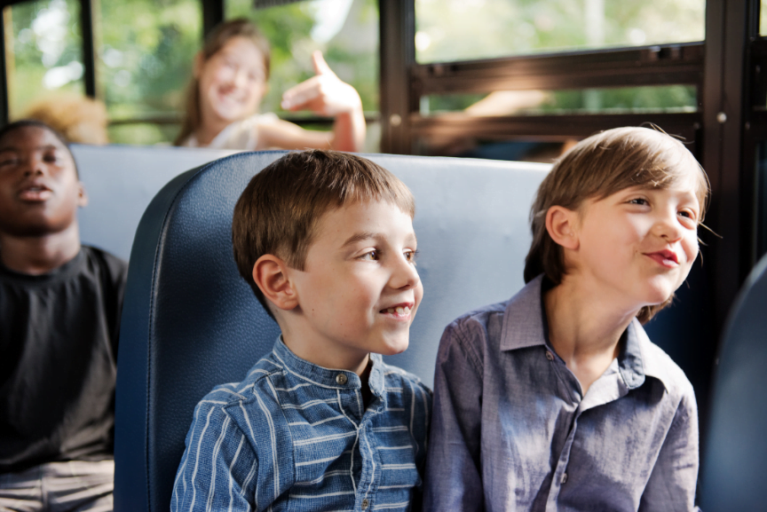 Boys above minimum age on bus