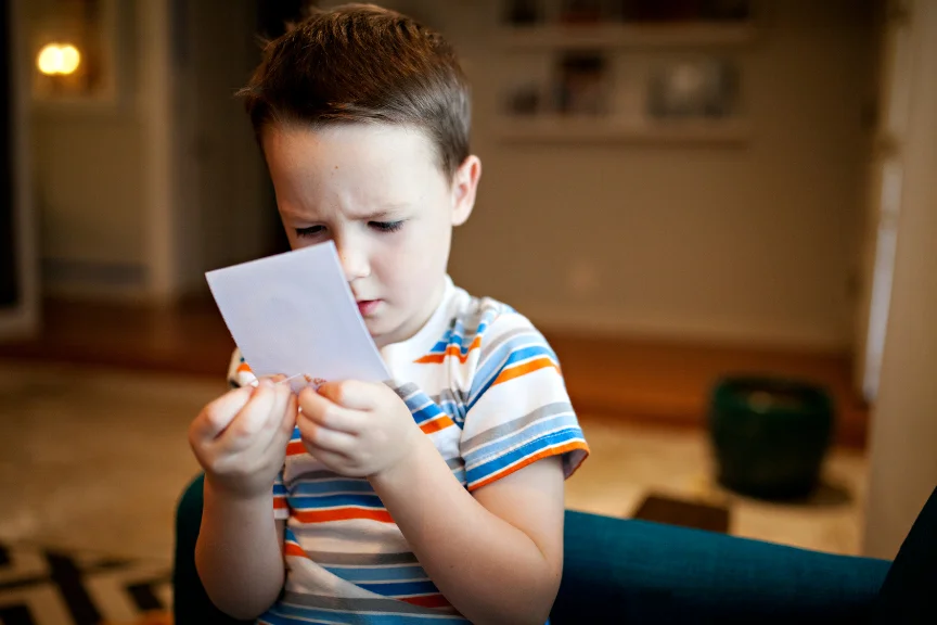 Older child building concentration and memory skills with card game