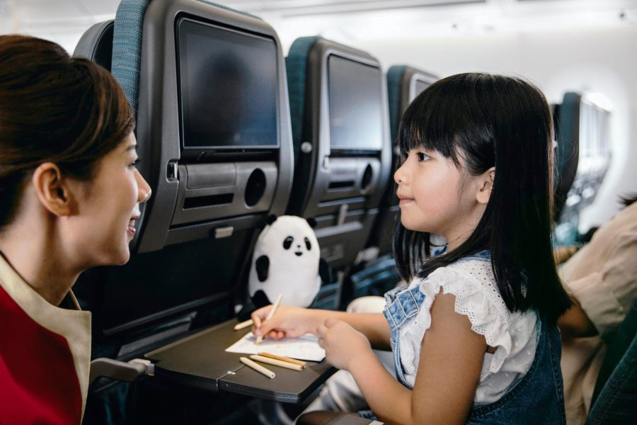 girl with flight attendant travelling alone