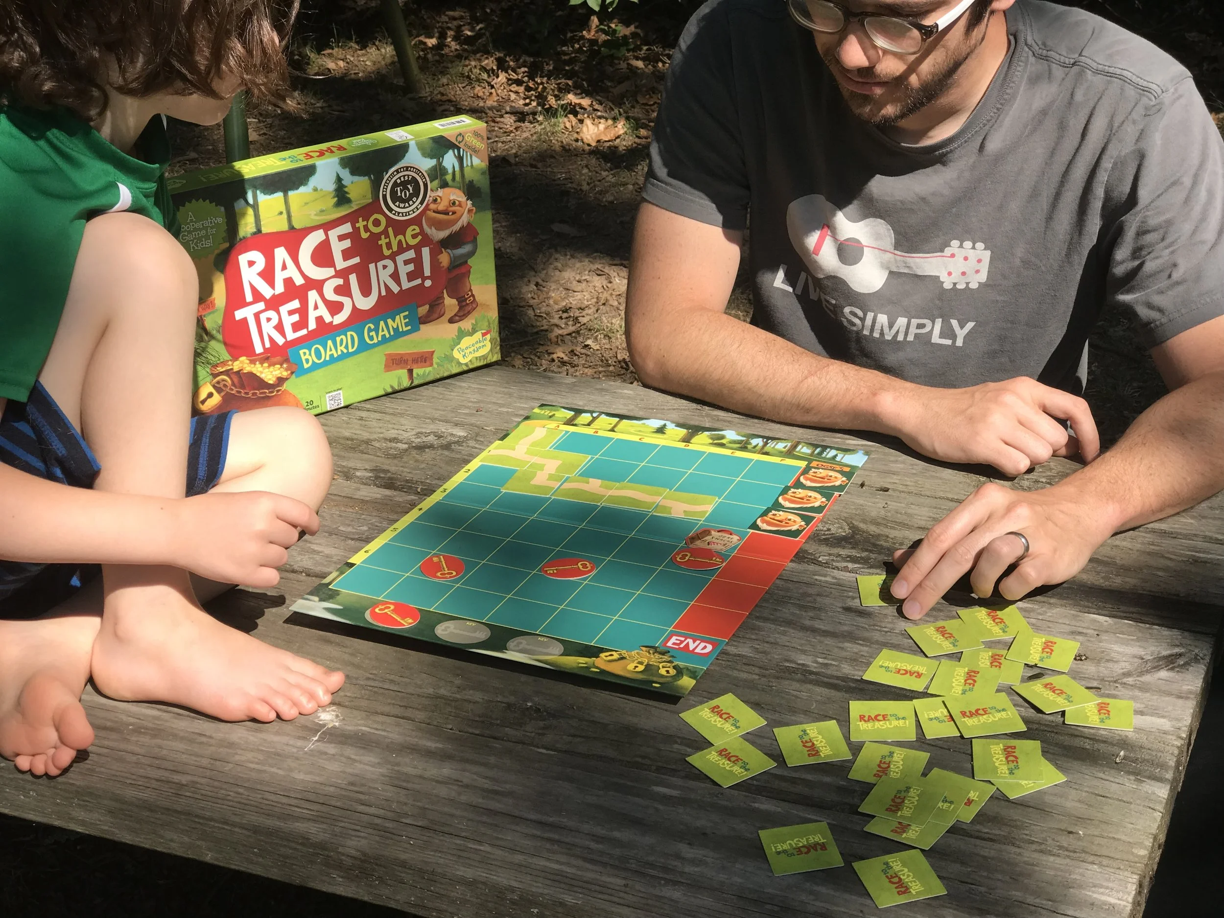 Family with children different ages playing number recognition game