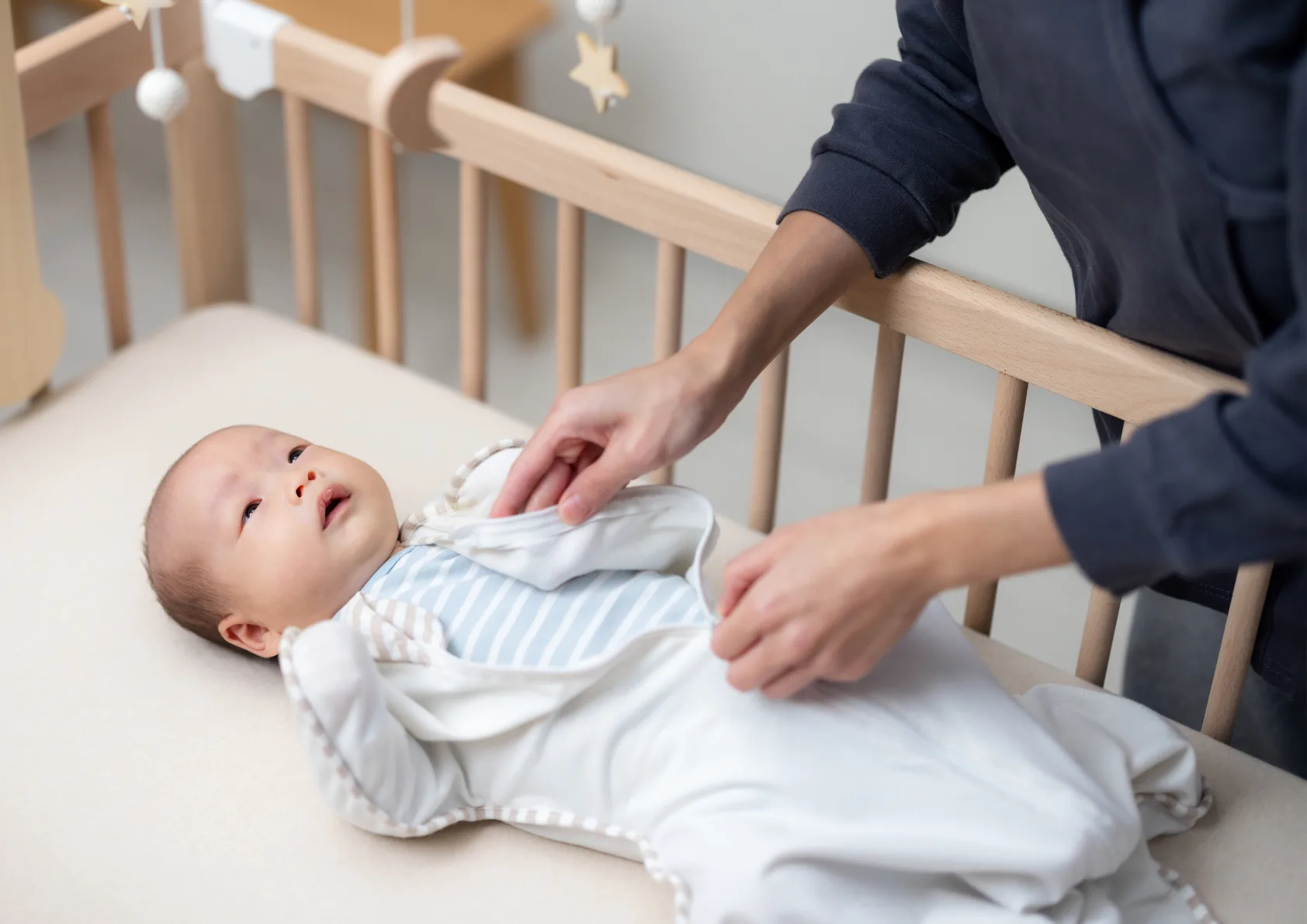 infant safe sleep set up in cot with mom