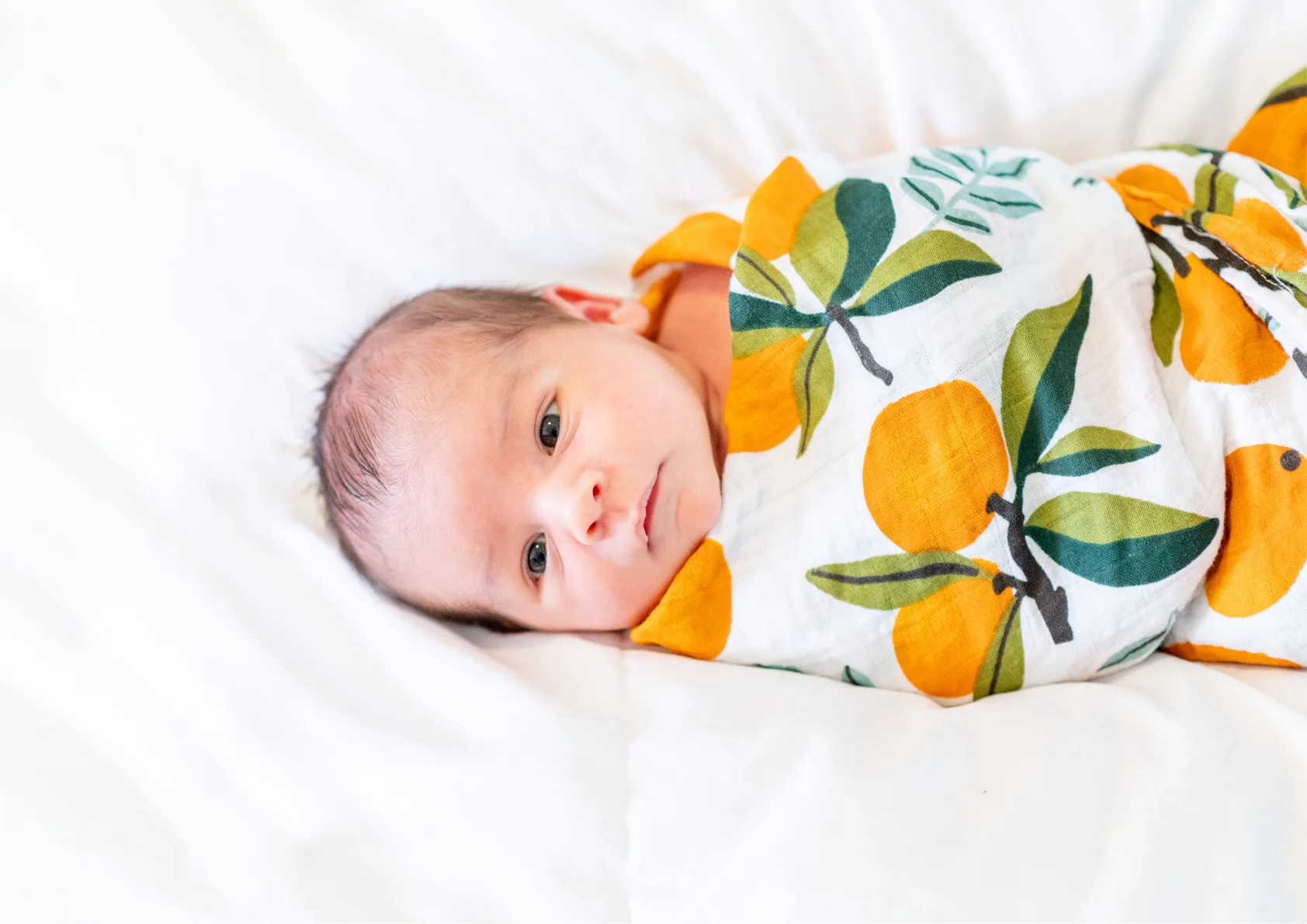Sweet baby wrapped in swaddle