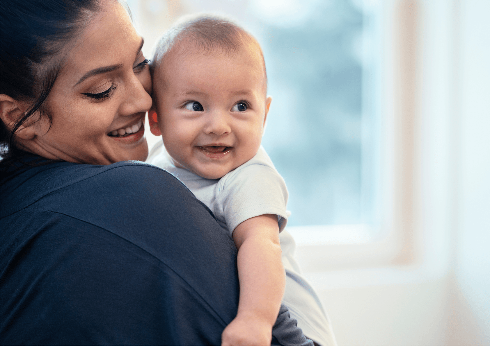 Mum with baby smiling on maternity leave about to have return to work with KIT day