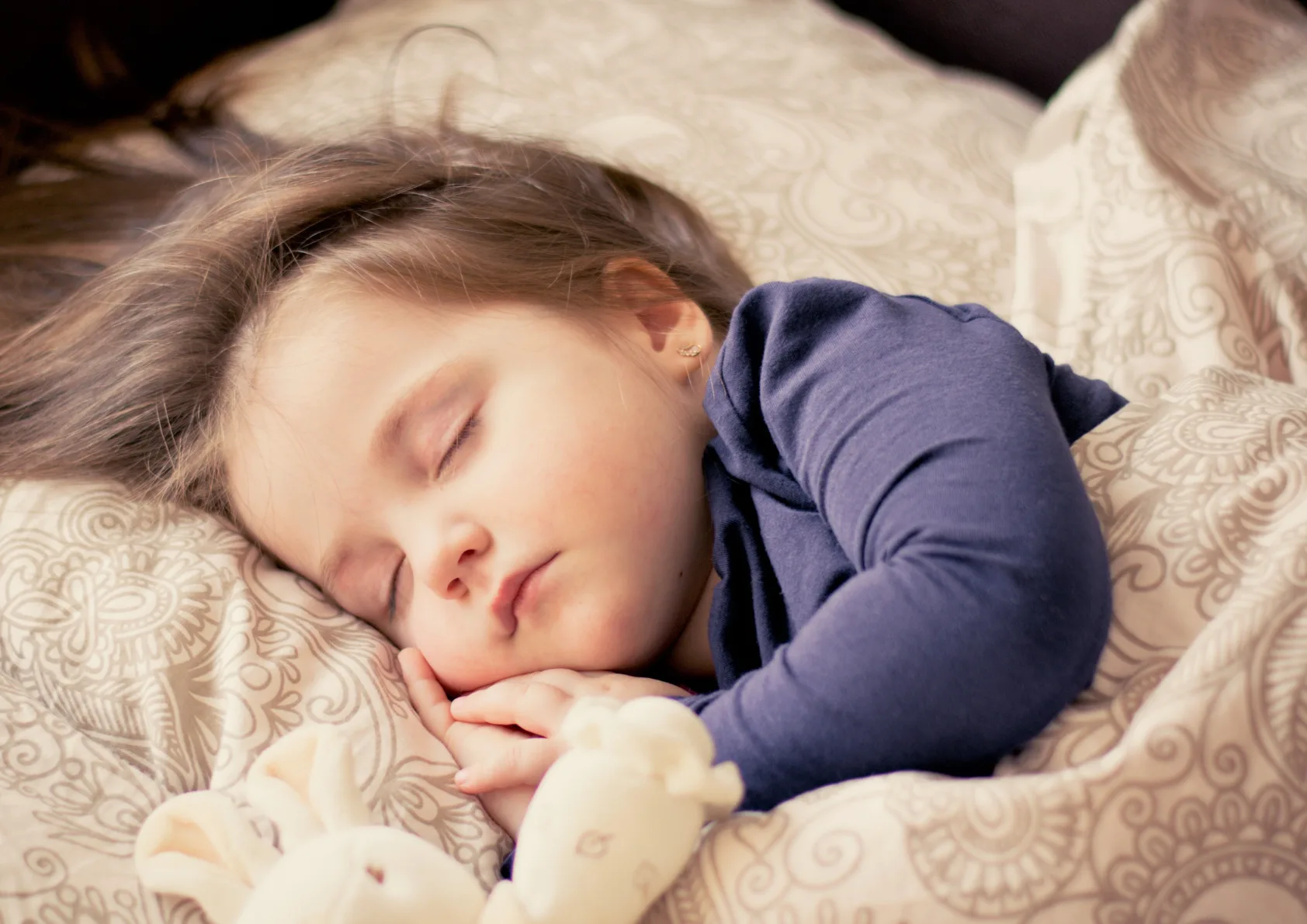 Baby sleeping soundly in bed