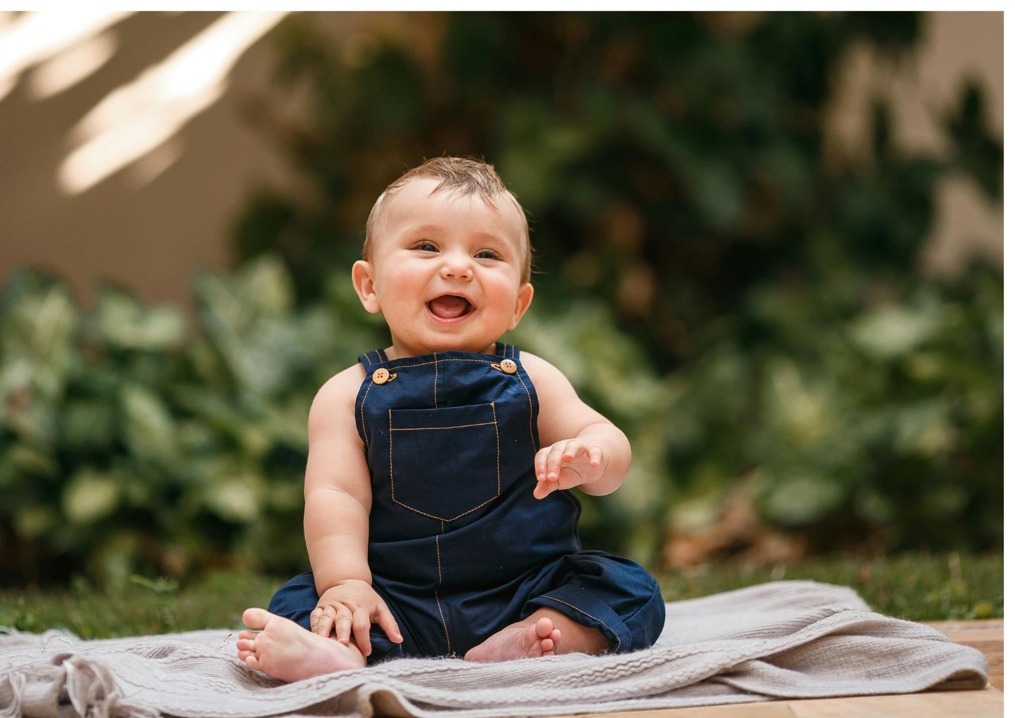 Laughing baby demonstrating developmental stages